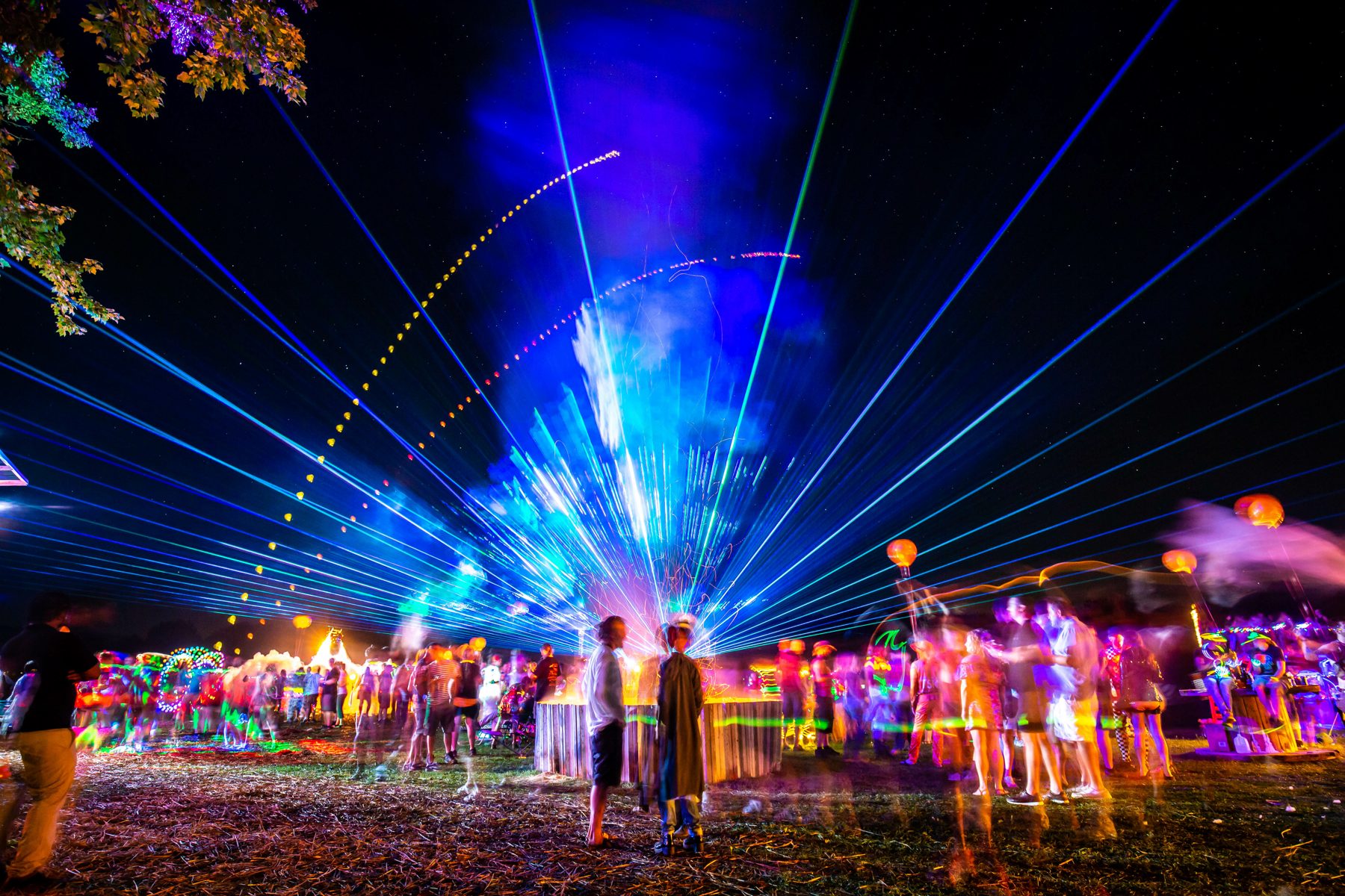 Event audience watching lights and pyrotechnic effects